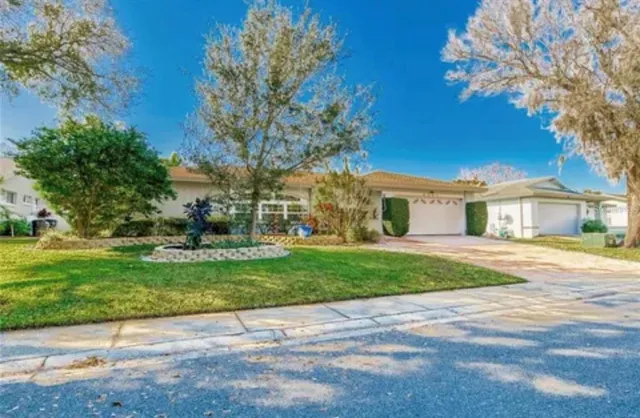 a view of a house with a garden