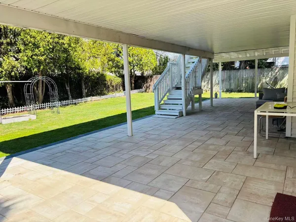 a view of a swimming pool with a yard