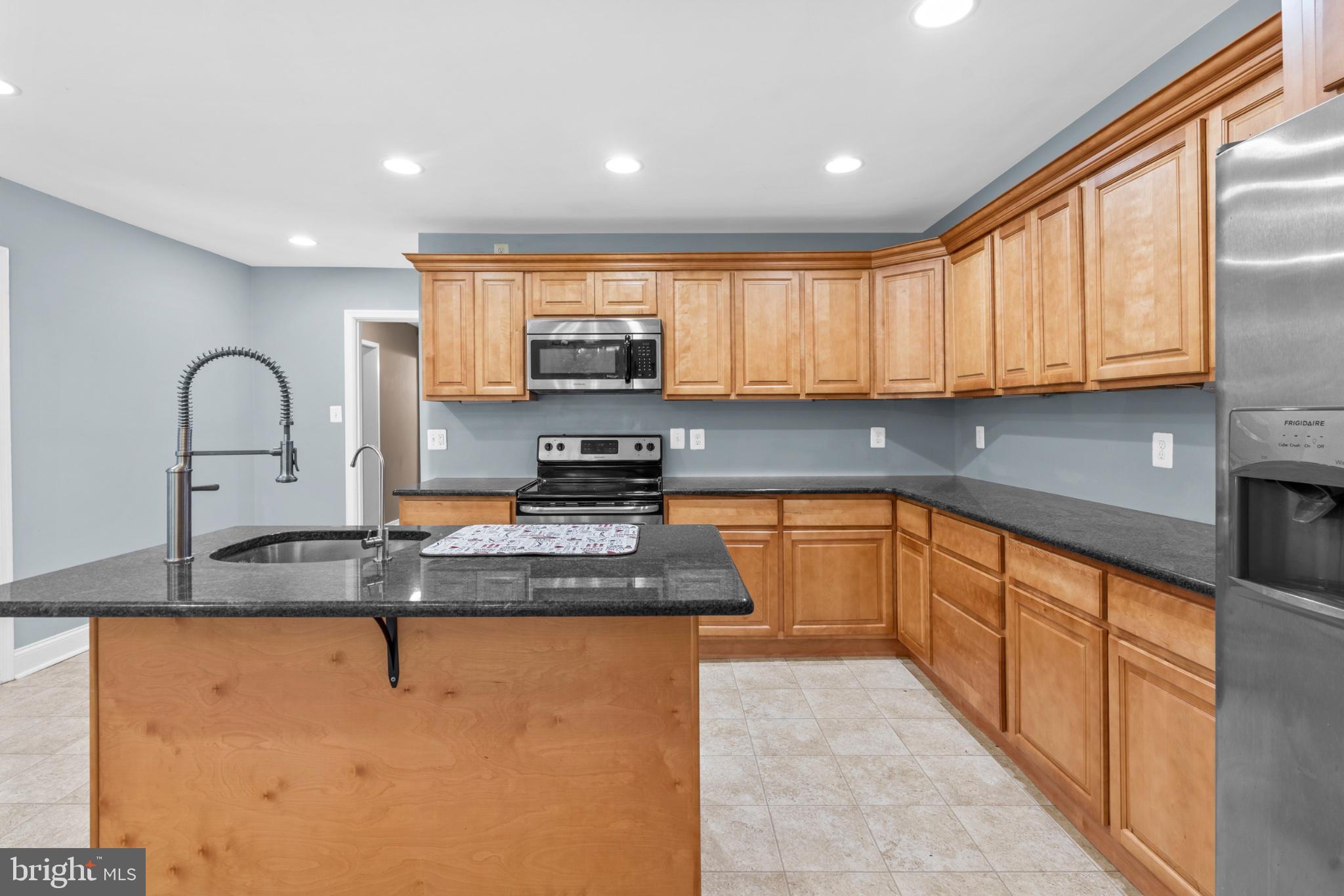 1457 Meetinghouse Road Warminster, PA 18974 - Photo 10 of 30 Modern kitchen with warm wood tones.