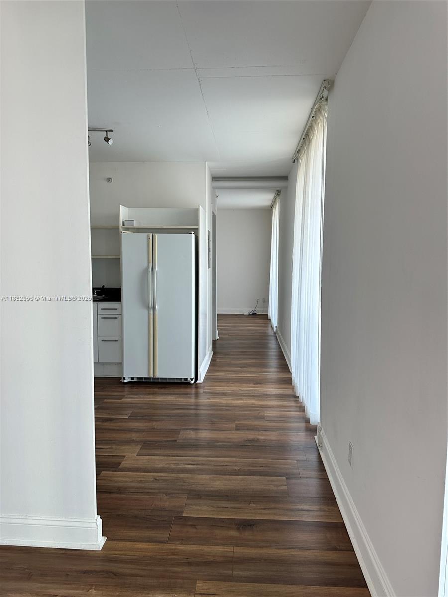690 Southwest 1st Court, Unit 605 Miami, FL 33130 - Photo 6 of 9 a view of a hallway with wooden floor
