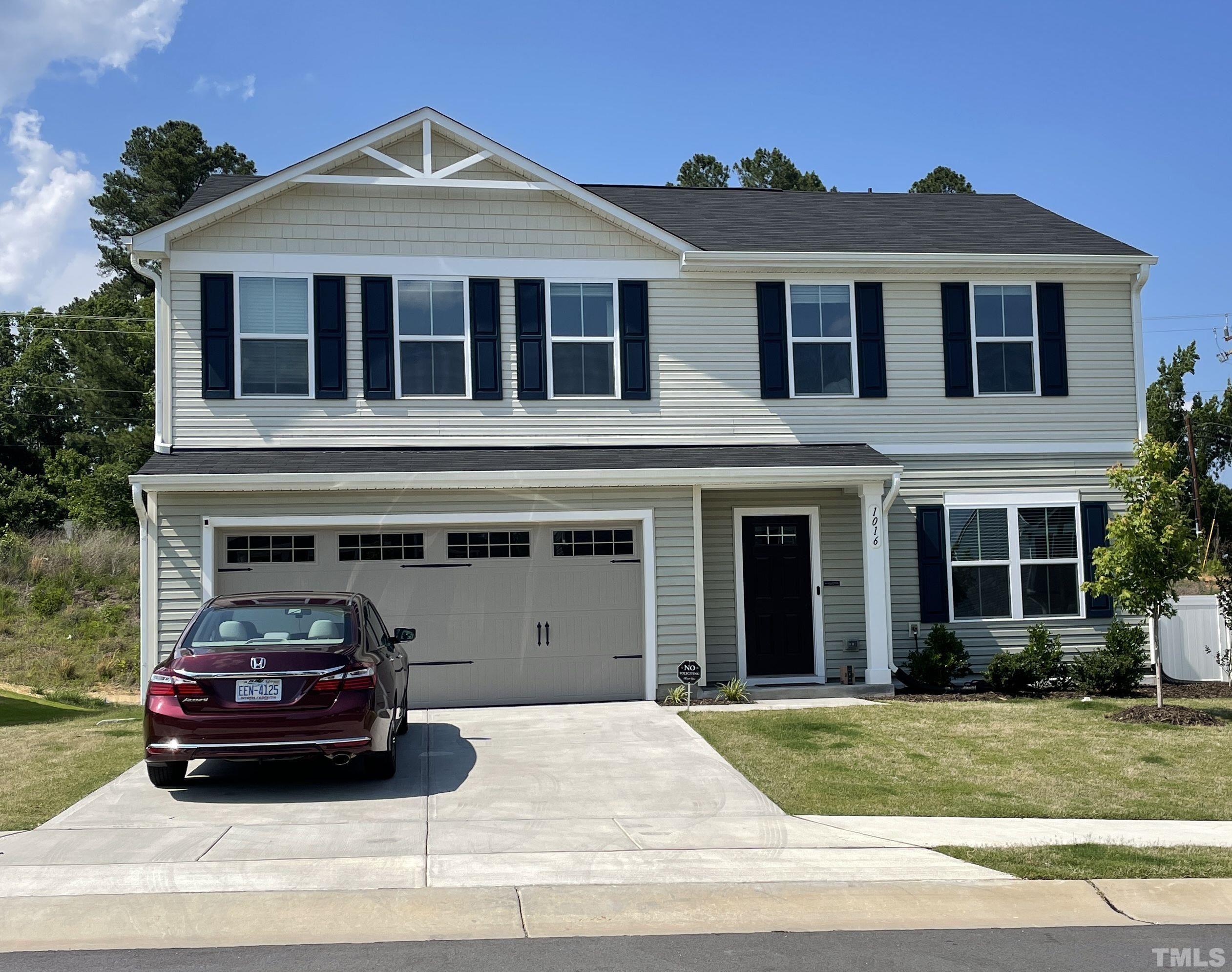 a car parked in front of a house