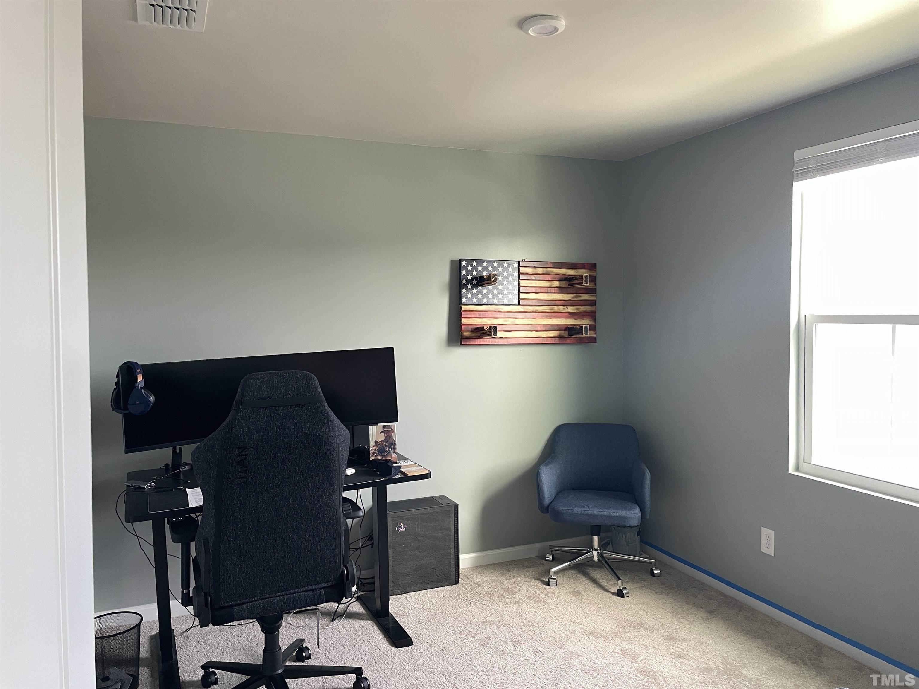 1016 Bent Willow Drive Durham, NC 27704 - Photo 13 of 20 a view of a workspace with furniture and a window