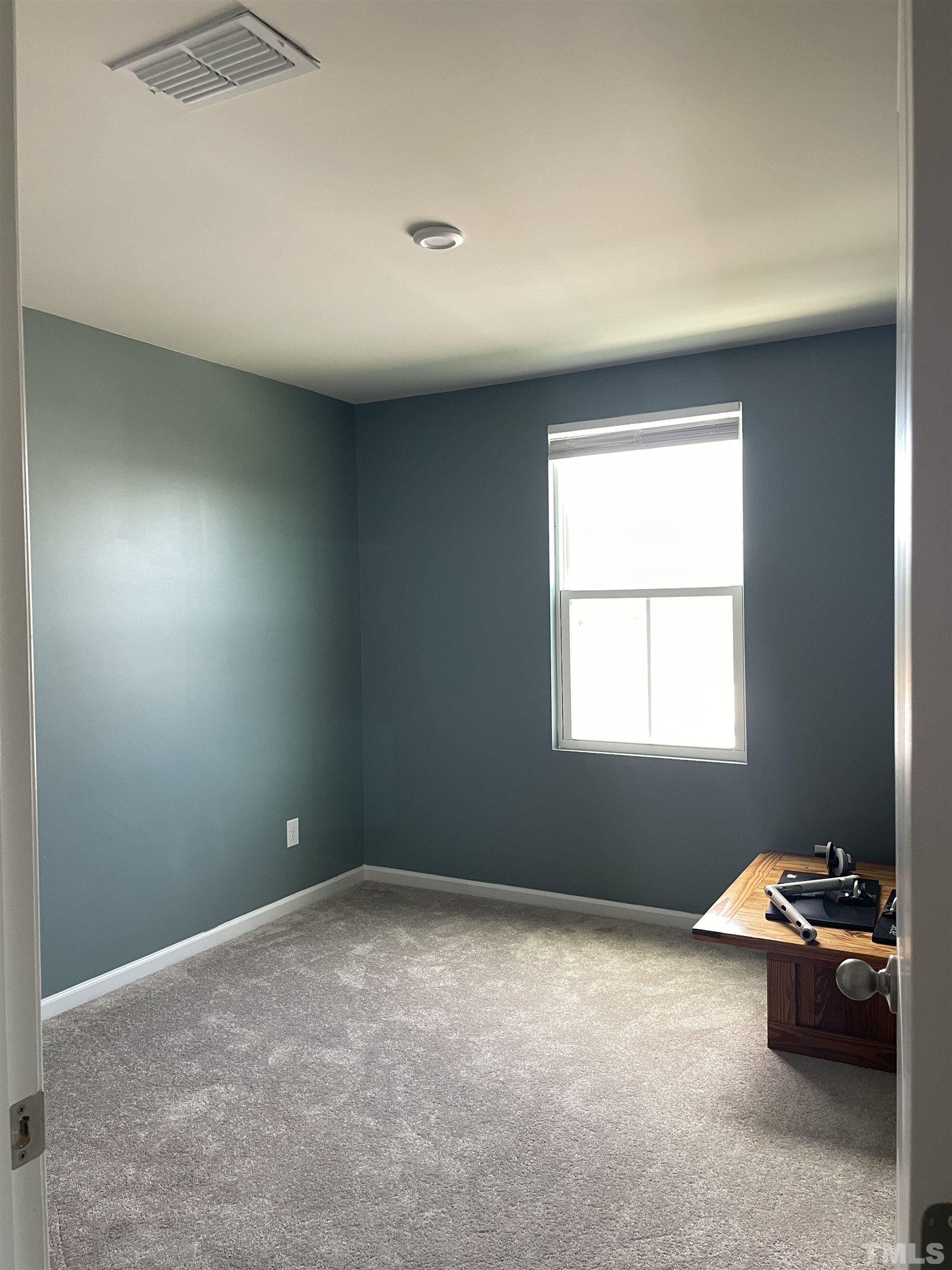 1016 Bent Willow Drive Durham, NC 27704 - Photo 14 of 20 an empty room with windows