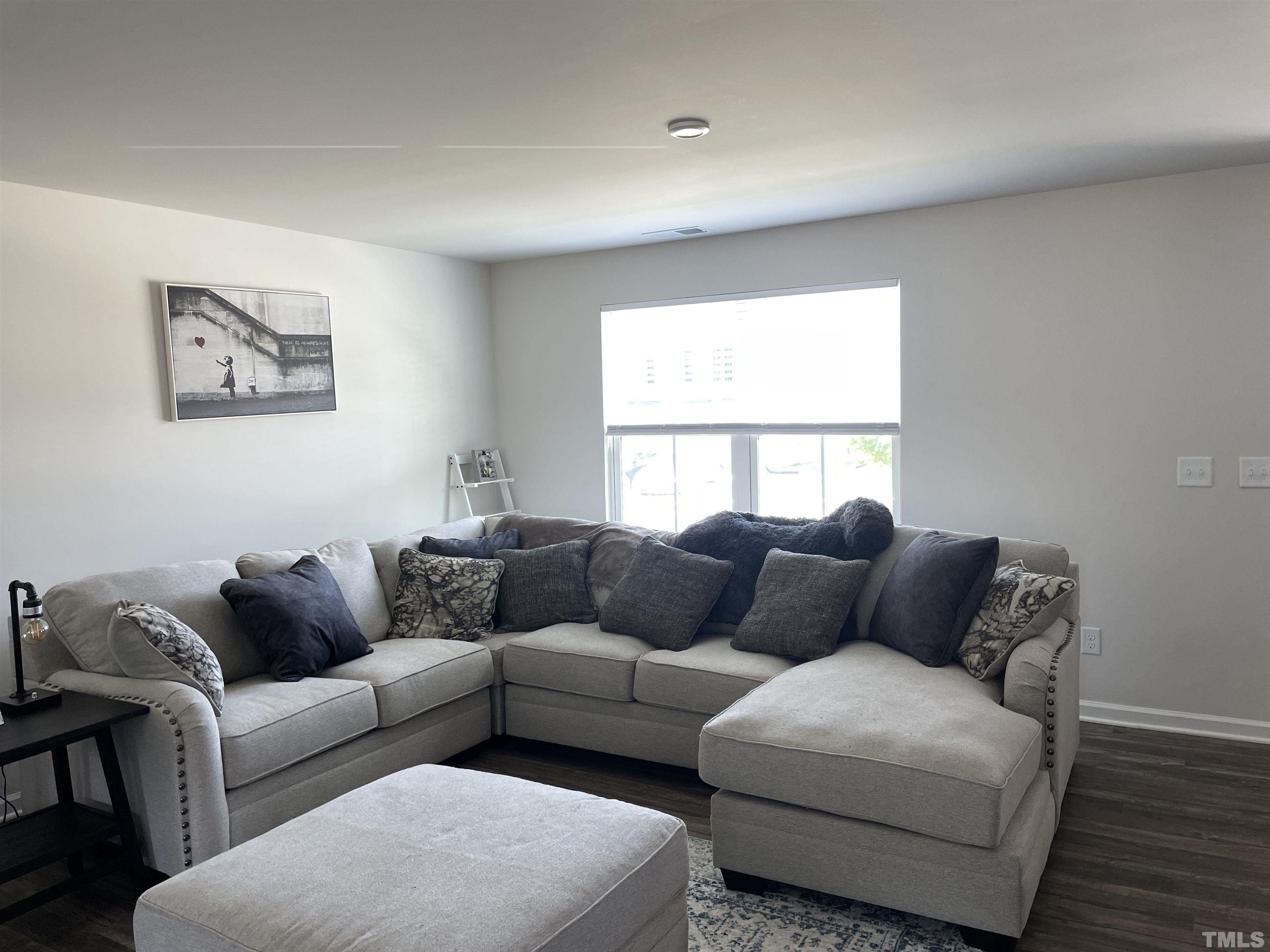 1016 Bent Willow Drive Durham, NC 27704 - Photo 3 of 20 a living room with furniture and a window