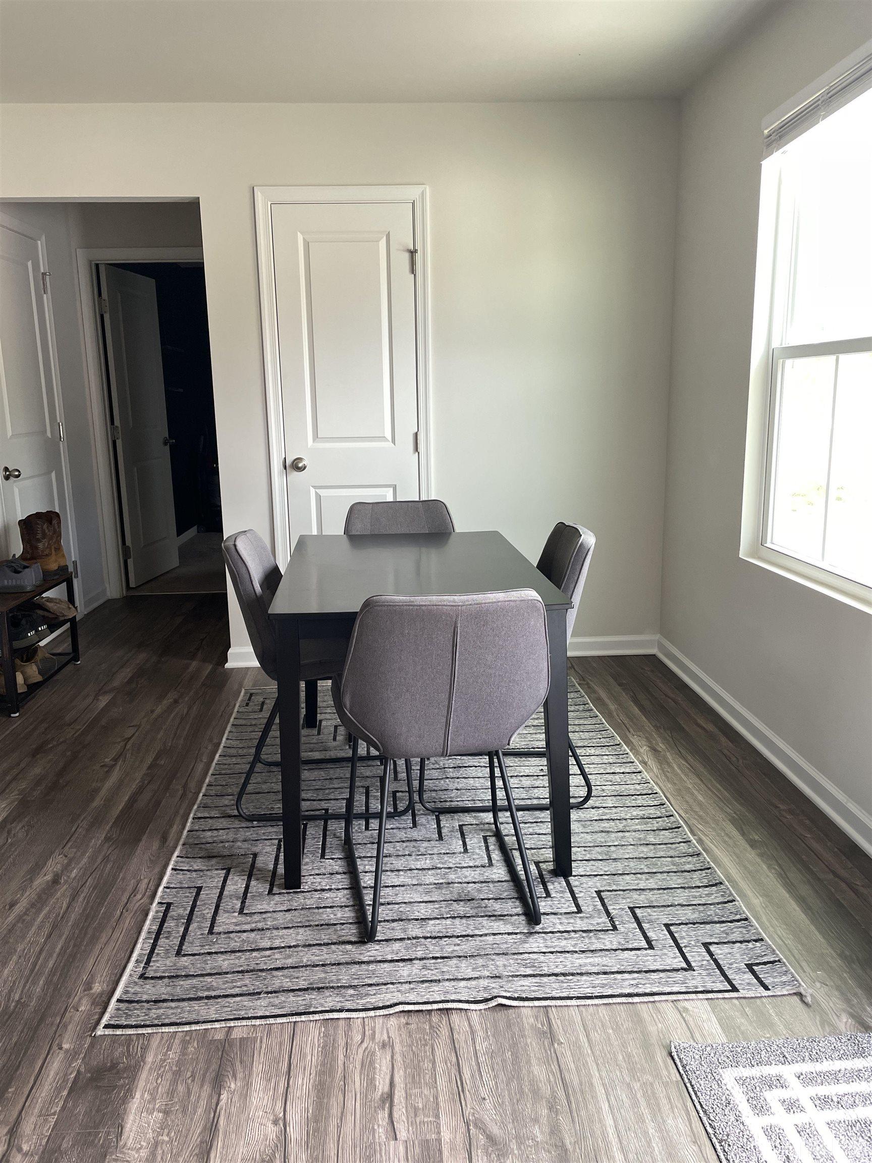 1016 Bent Willow Drive Durham, NC 27704 - Photo 7 of 20 a view of a dining room with furniture