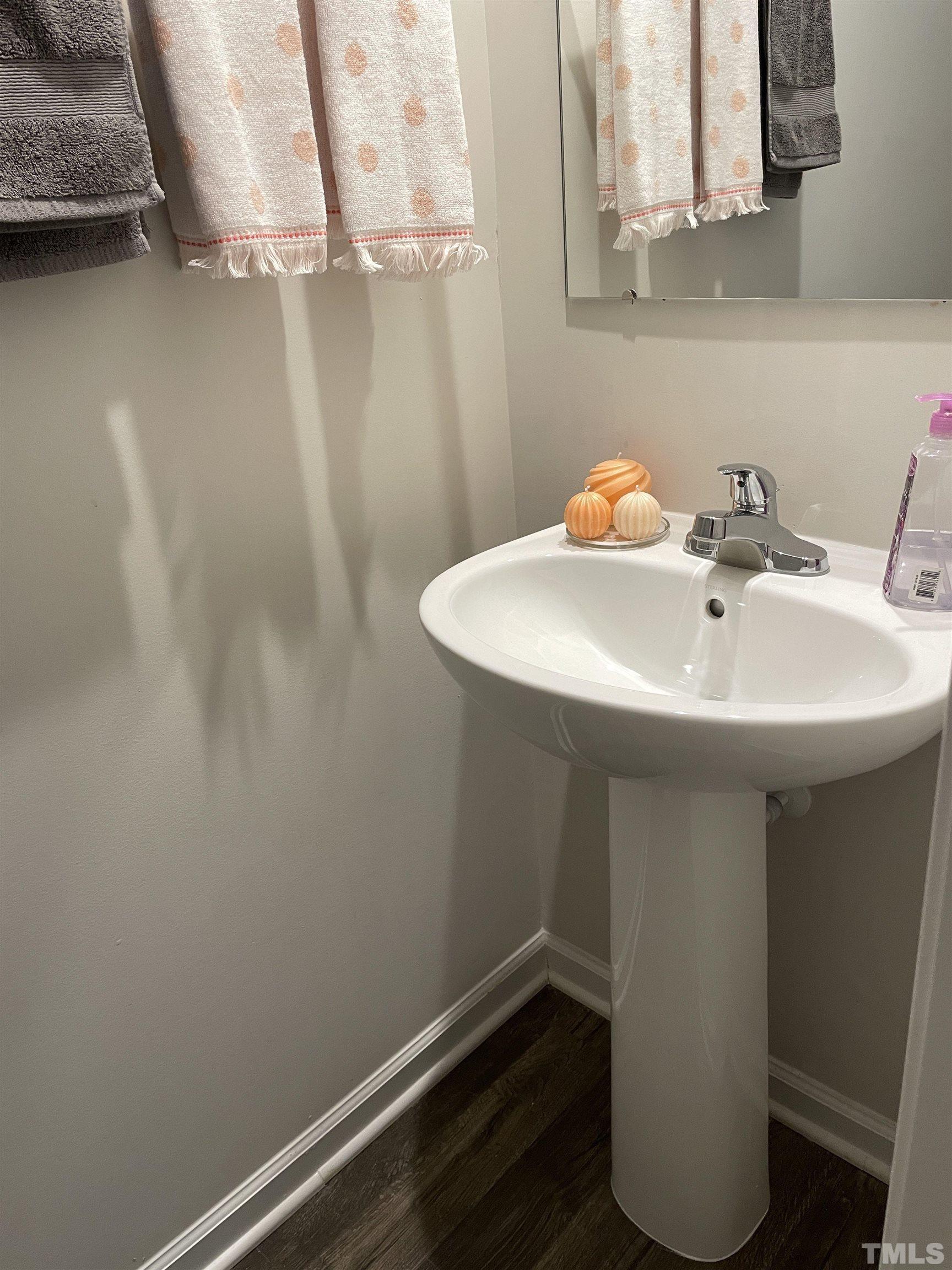 1016 Bent Willow Drive Durham, NC 27704 - Photo 8 of 20 a bathroom with a sink and a mirror