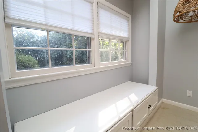 a room with a bed and a window