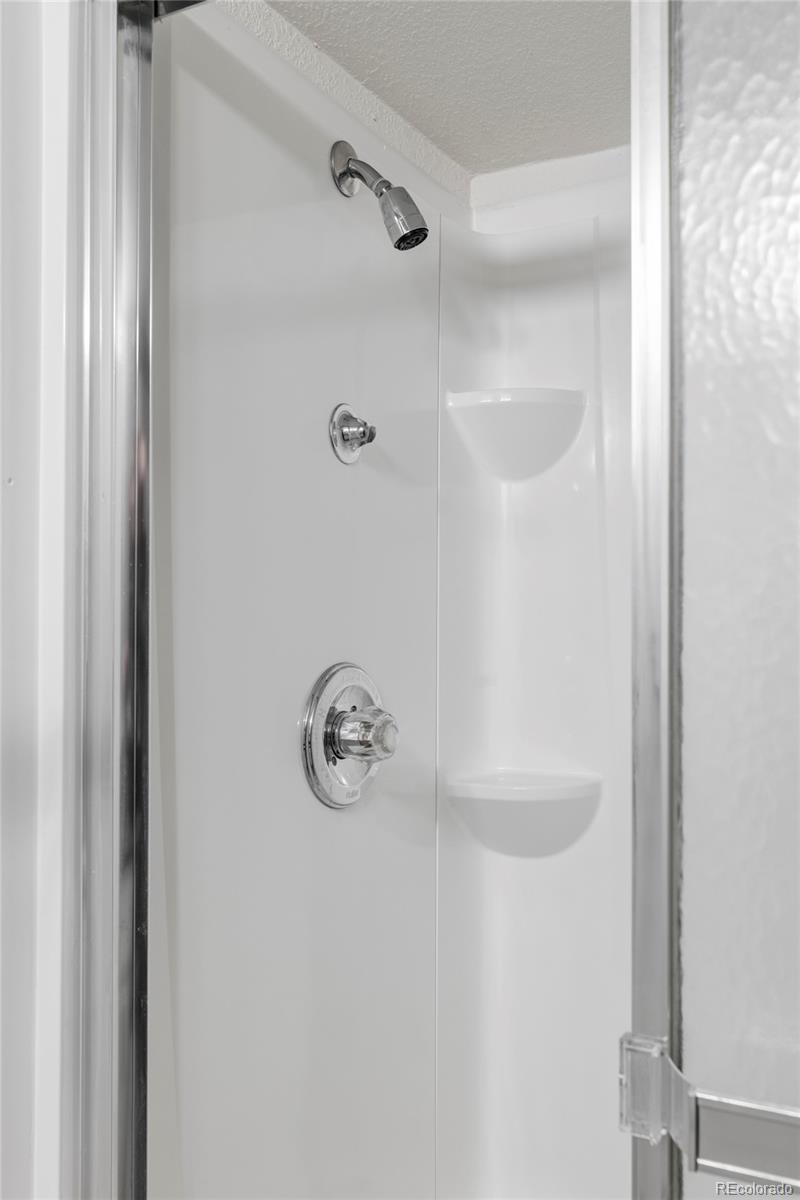 597 Rider Ridge Drive Longmont, CO 80504 - Photo 27 of 31 a bathroom with a shower