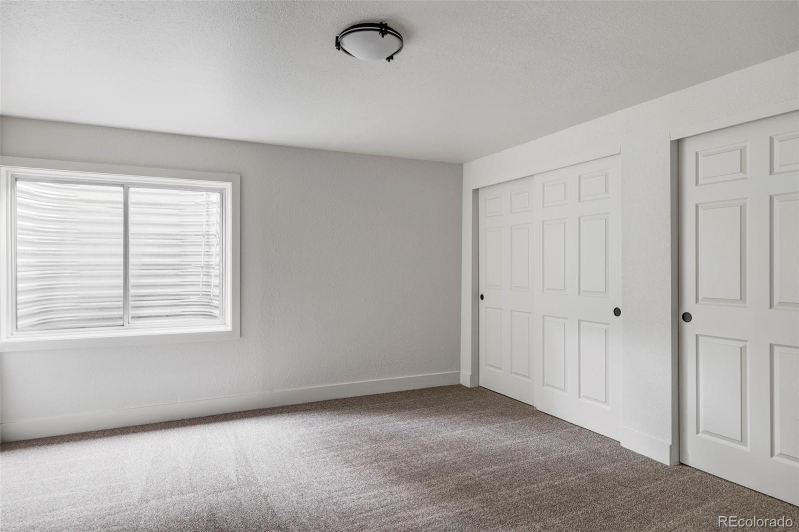 597 Rider Ridge Drive Longmont, CO 80504 - Photo 28 of 31 a view of an empty room with a window