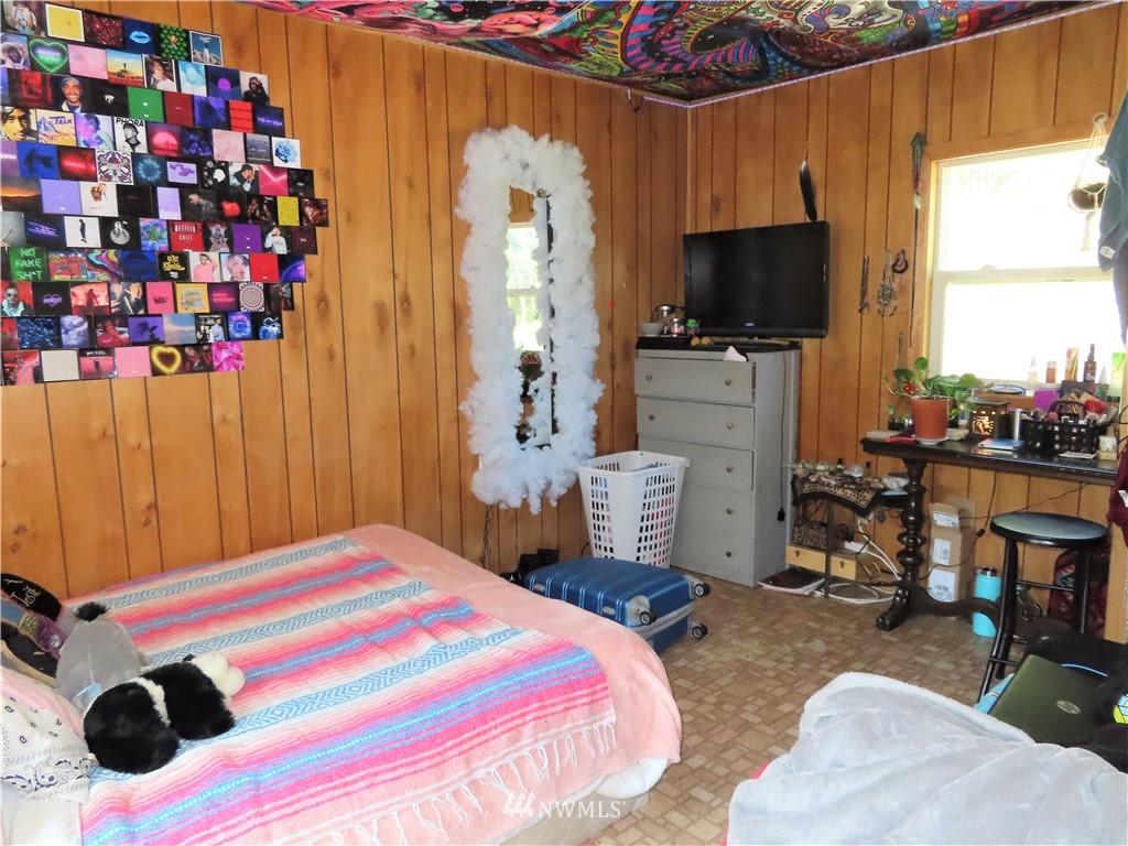 347 West Curlew Lake Road Republic, WA 99166 - Photo 16 of 26 a bedroom with a bed and a flat screen tv