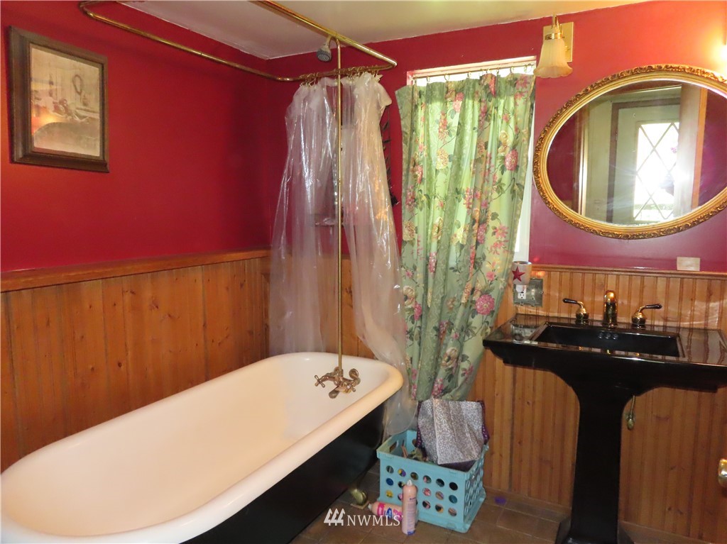347 West Curlew Lake Road Republic, WA 99166 - Photo 17 of 26 a bathroom with a sink vanity and a mirror