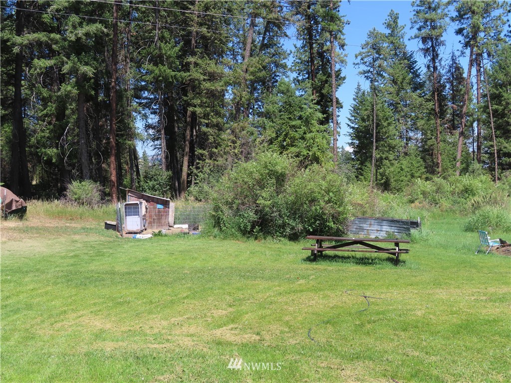 347 West Curlew Lake Road Republic, WA 99166 - Photo 23 of 26 a view of a bench in a garden