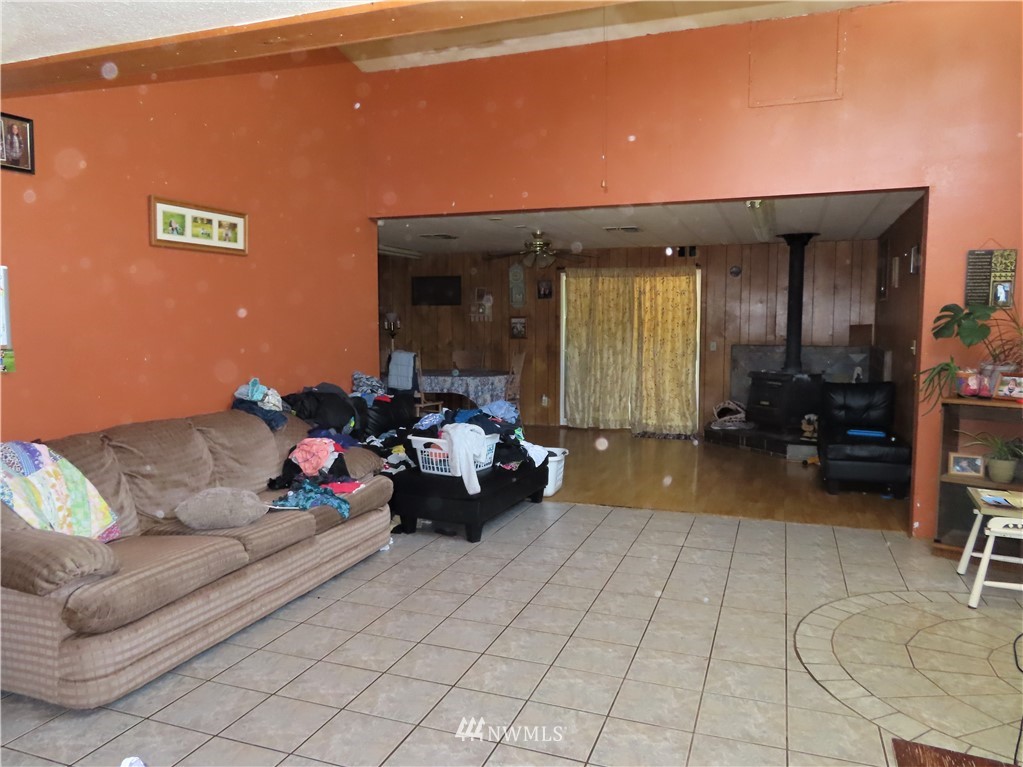 347 West Curlew Lake Road Republic, WA 99166 - Photo 6 of 26 a living room with furniture and a potted plant