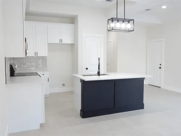 a bathroom with a sink vanity and a mirror