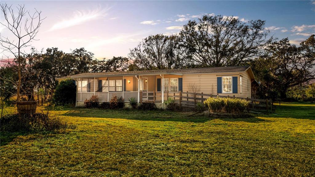 Nice manufactured home on nearly 2 acres, fully fenced, and NO HOA