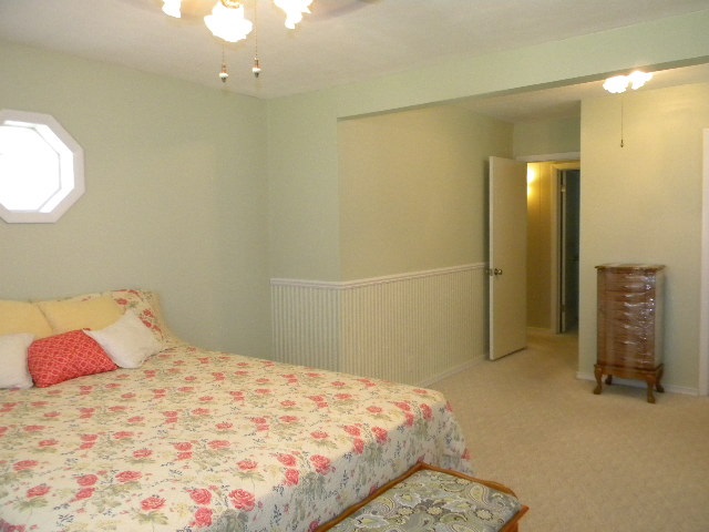 14049 South Bluff Road Rockton, IL 61072 - Photo 14 of 25 a bedroom with a bed and a mirror