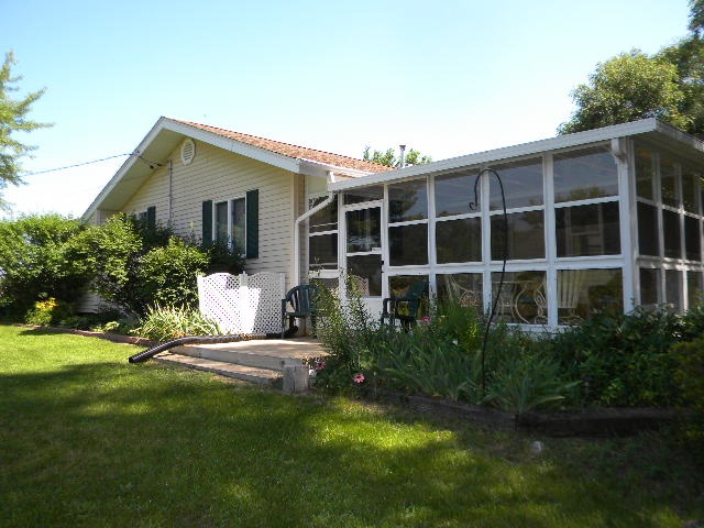 14049 South Bluff Road Rockton, IL 61072 - Photo 22 of 25 a view of a house with backyard and sitting area