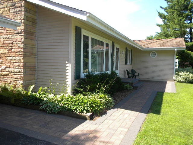 14049 South Bluff Road Rockton, IL 61072 - Photo 3 of 25 a front view of a house with a yard