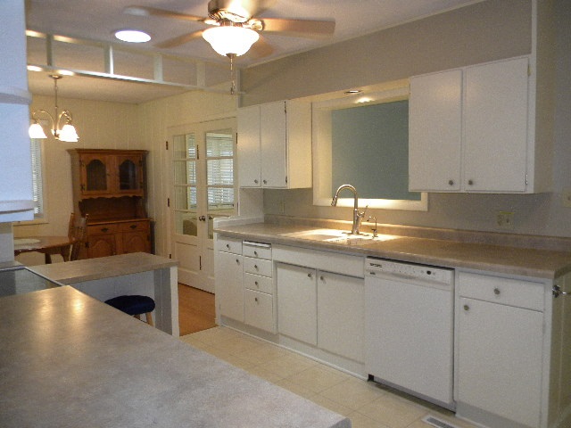 14049 South Bluff Road Rockton, IL 61072 - Photo 7 of 25 a kitchen with sink and cabinets