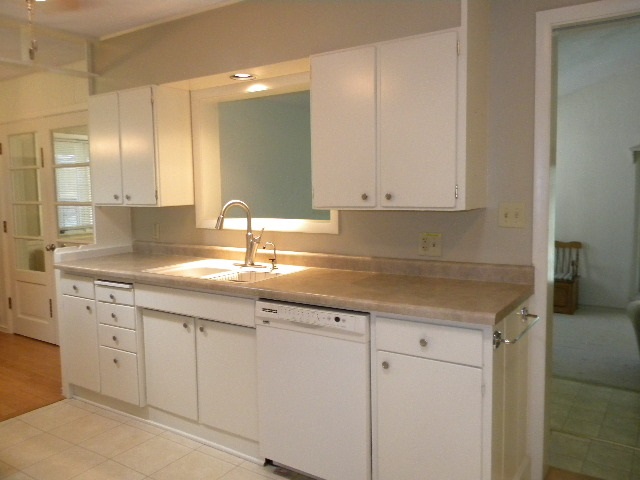 14049 South Bluff Road Rockton, IL 61072 - Photo 9 of 25 a kitchen with granite countertop white cabinets and a sink