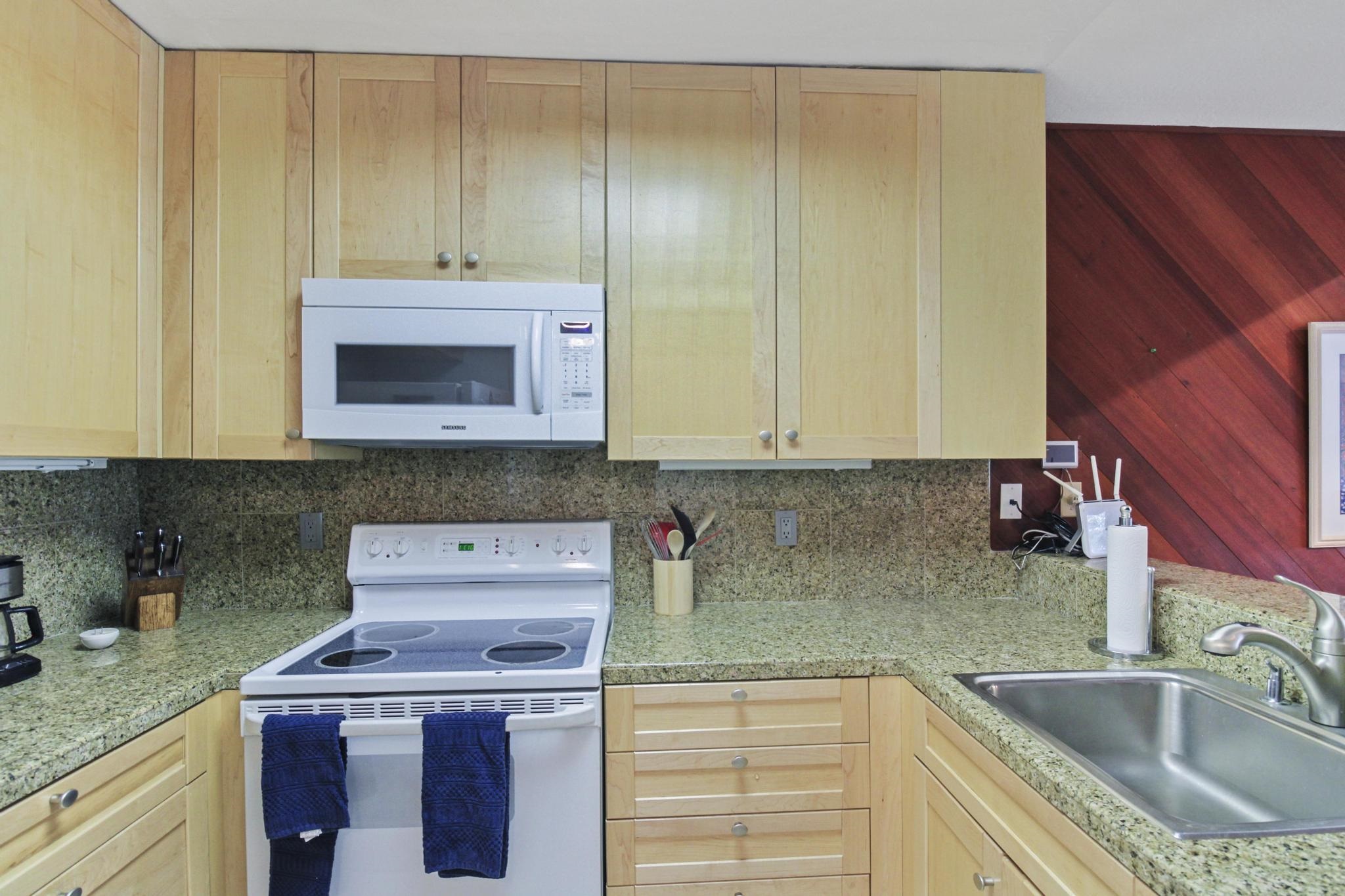 2090 Chalet Road, Unit 2 Alpine Meadows, CA 96146 - Photo 3 of 23 a kitchen with stainless steel appliances granite countertop a sink a stove and cabinets