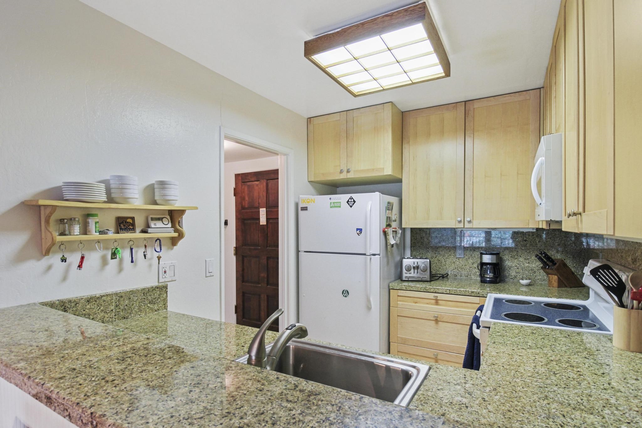 2090 Chalet Road, Unit 2 Alpine Meadows, CA 96146 - Photo 6 of 23 a kitchen with a refrigerator sink and cabinets
