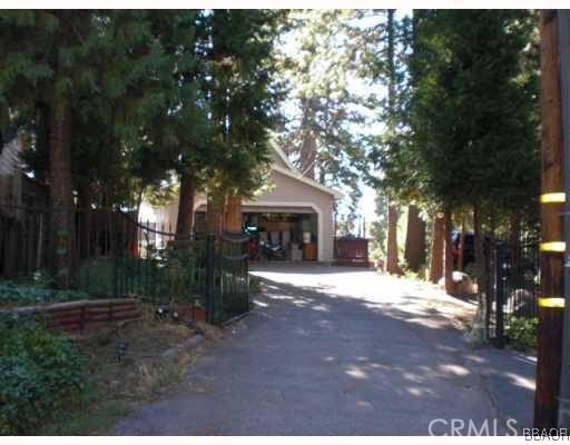151 Cedar Lane Road Crestline, CA 92325 - Photo 2 of 8 a front view of a house with a garden