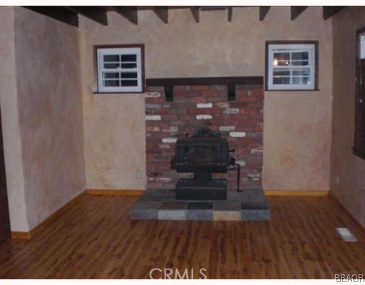 151 Cedar Lane Road Crestline, CA 92325 - Photo 4 of 8 a view of empty room with wooden floor