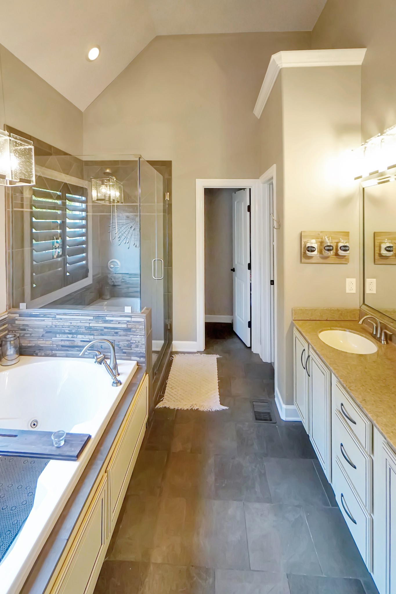 116 Cassandra Drive Cottontown, TN 37048 - Photo 15 of 53 a bathroom with a granite countertop tub sink and mirror