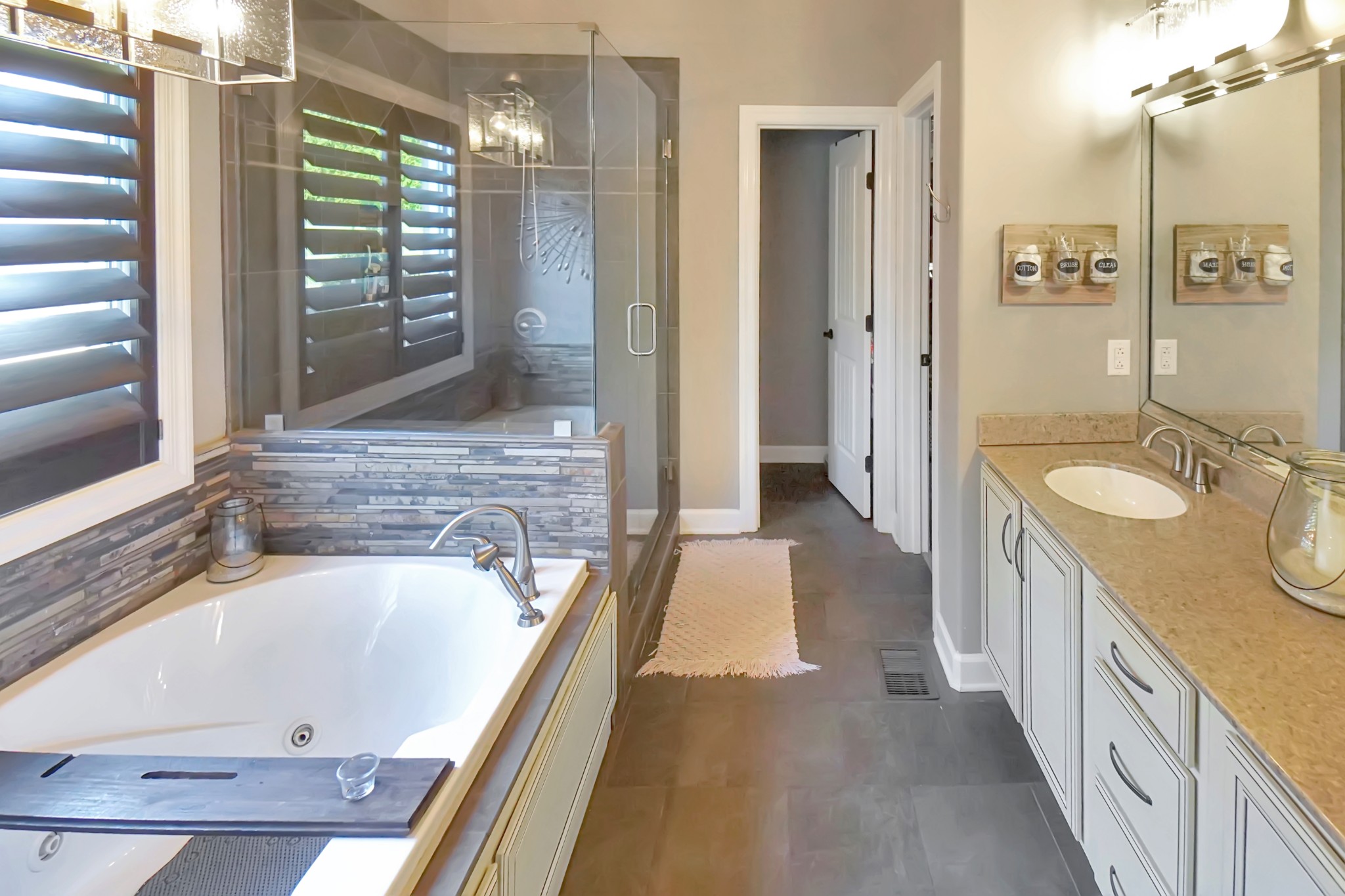 116 Cassandra Drive Cottontown, TN 37048 - Photo 16 of 53 a bathroom with a granite countertop tub sink and mirror