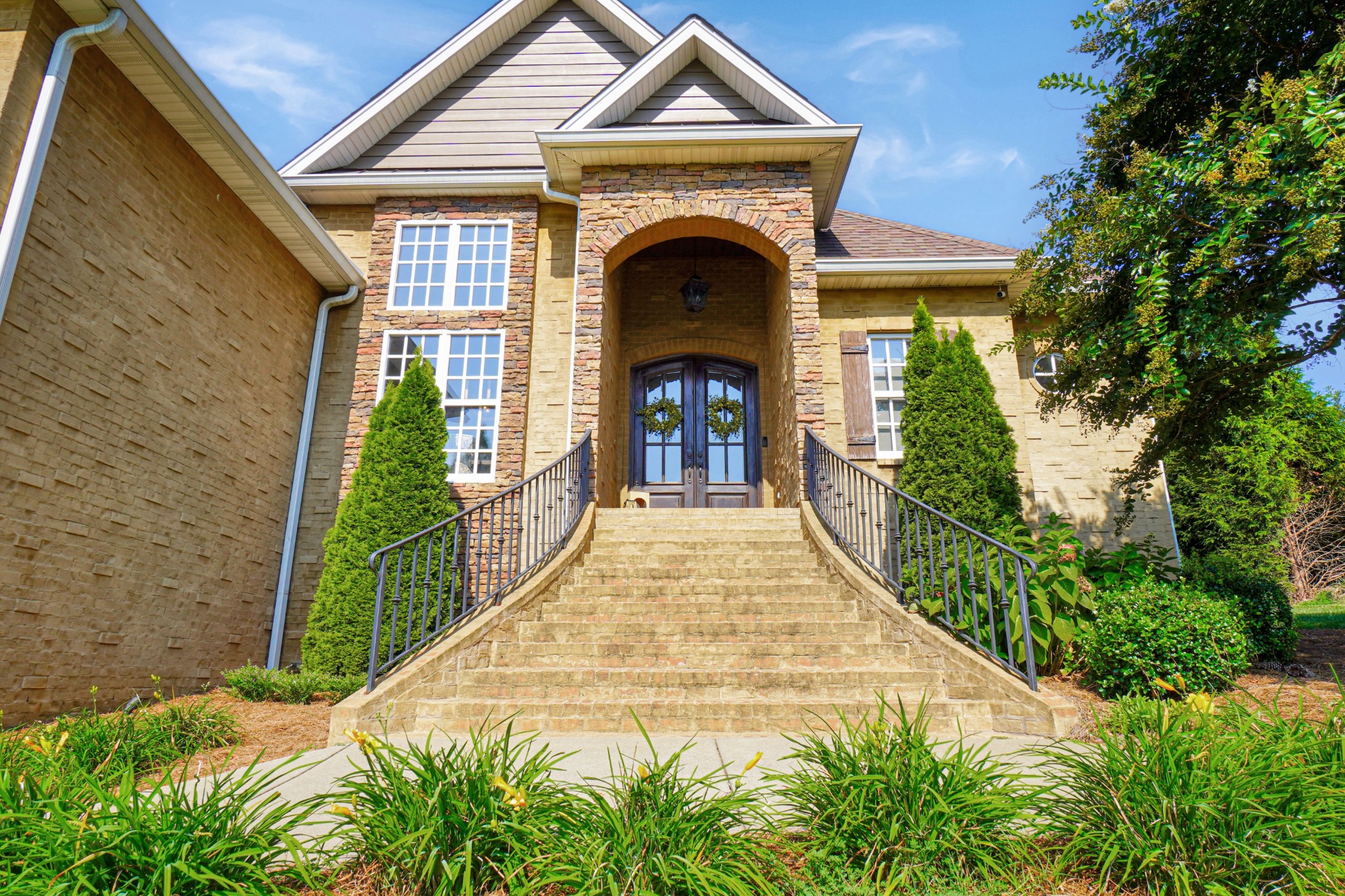116 Cassandra Drive Cottontown, TN 37048 - Photo 2 of 53 a front view of a house with a garden