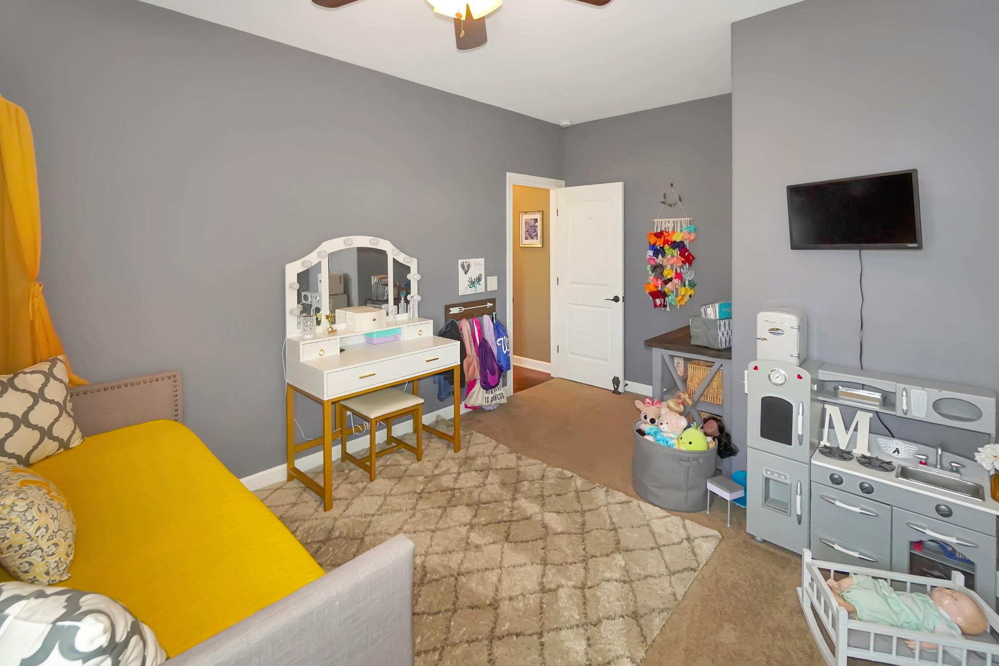 116 Cassandra Drive Cottontown, TN 37048 - Photo 23 of 53 a living room with furniture and a flat screen tv