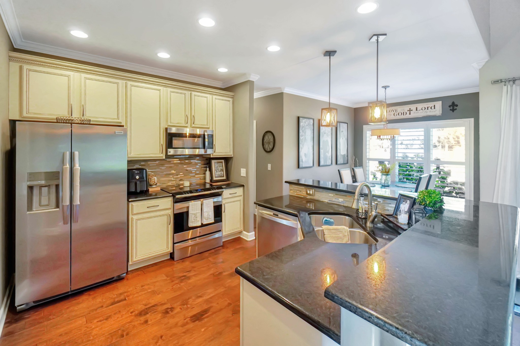 116 Cassandra Drive Cottontown, TN 37048 - Photo 30 of 53 a kitchen with stainless steel appliances granite countertop a sink a stove and a refrigerator