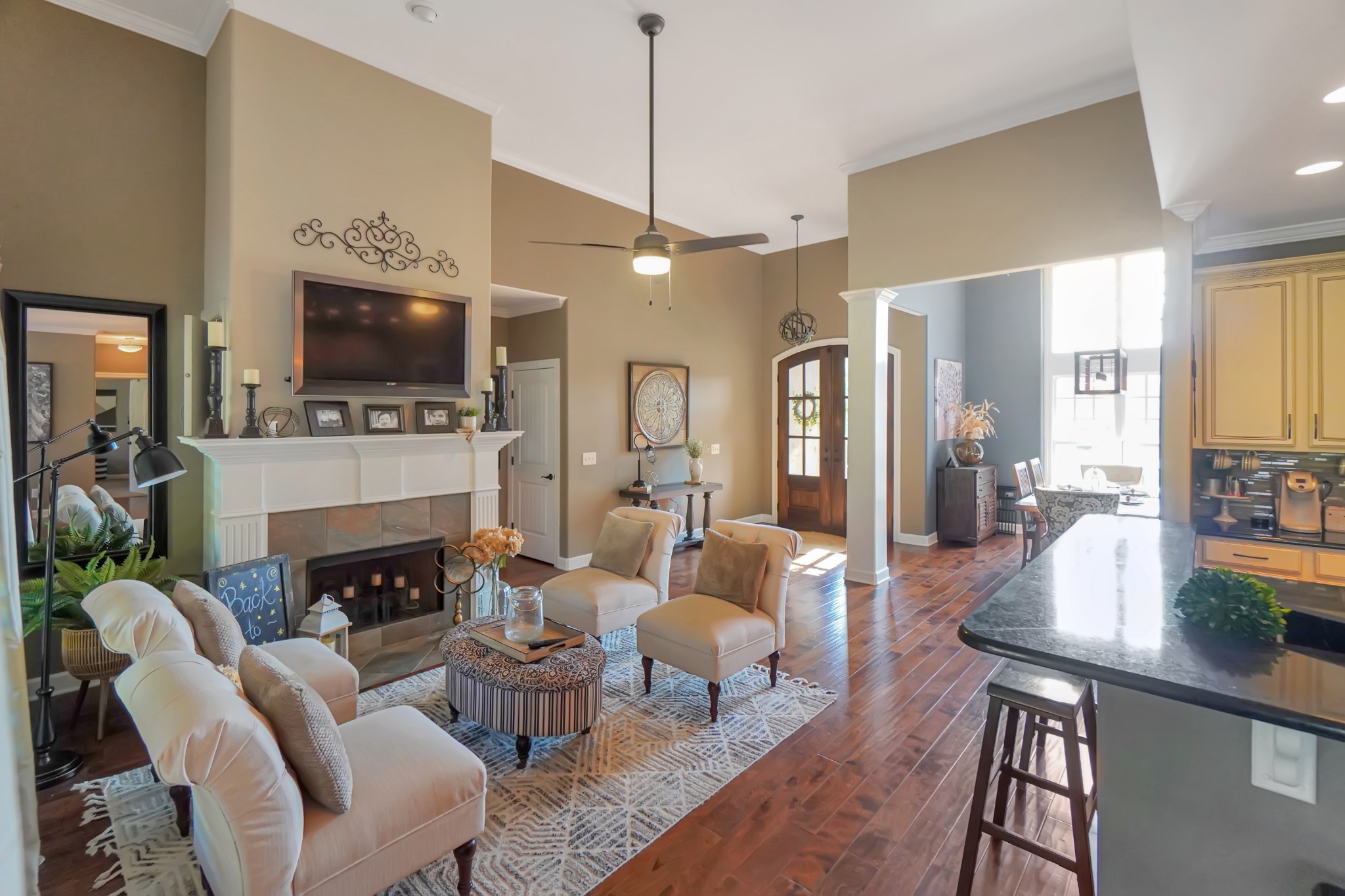 116 Cassandra Drive Cottontown, TN 37048 - Photo 33 of 53 a living room with furniture a fireplace and a flat screen tv
