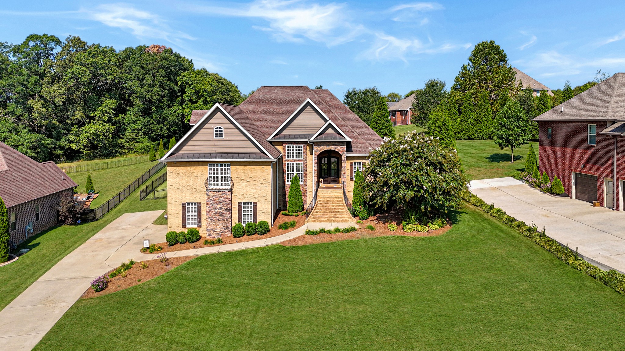 116 Cassandra Drive Cottontown, TN 37048 - Photo 48 of 53 a view of a house with a big yard plants and large tree