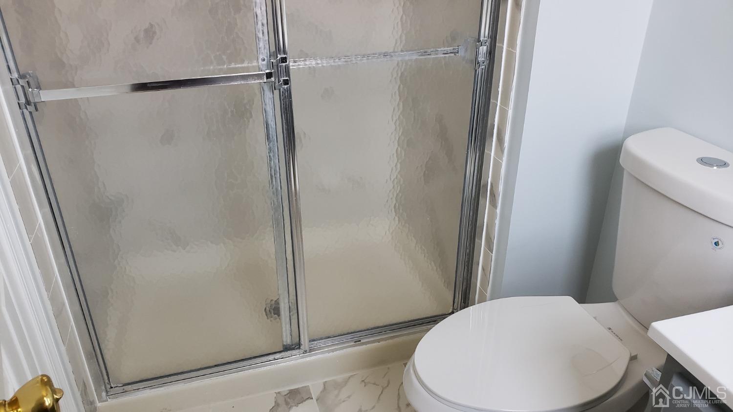 311 Classon Court Somerset, NJ 08873 - Photo 14 of 20 a bathroom with a toilet and a shower