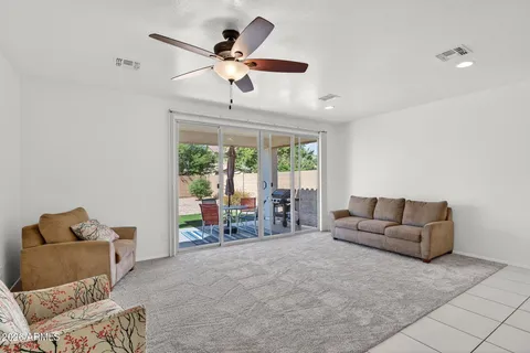 a kitchen with stainless steel appliances granite countertop a sink and a refrigerator