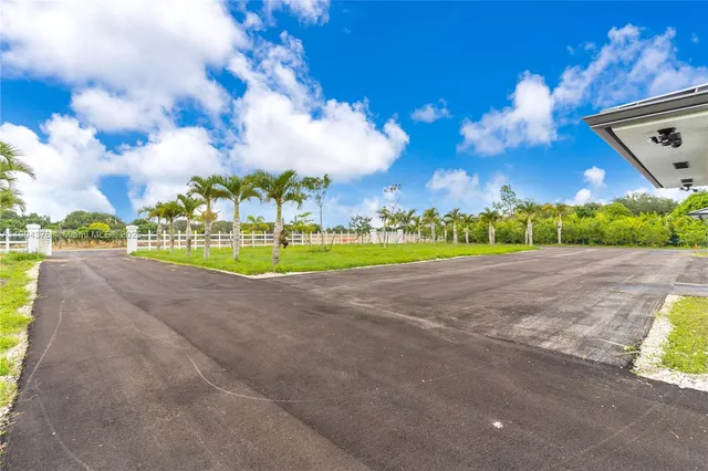 a view of a golf course with a house