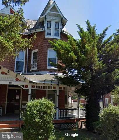 a view of balcony with plants and trees