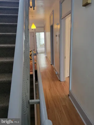 a view of entryway with wooden floor