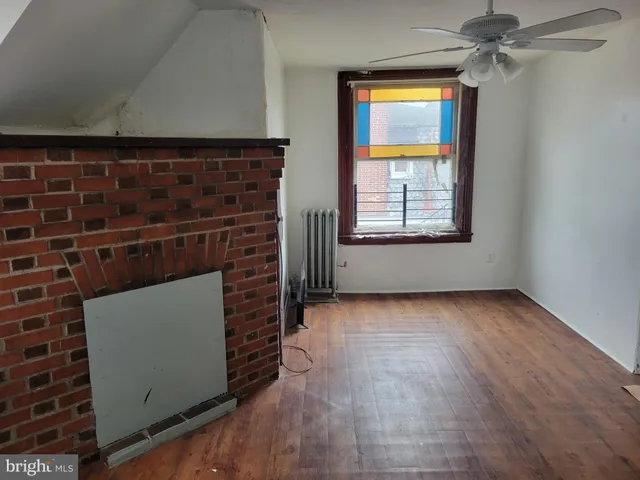 a view of an empty room and window