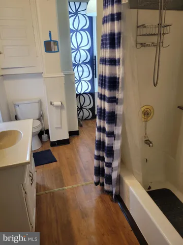 a bathroom with a bathtub and shower