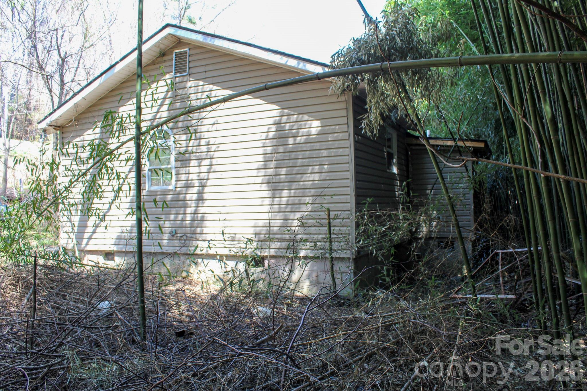 1293 Lake Logan Road Canton, NC 28716 - Photo 15 of 48 a backyard view of a house