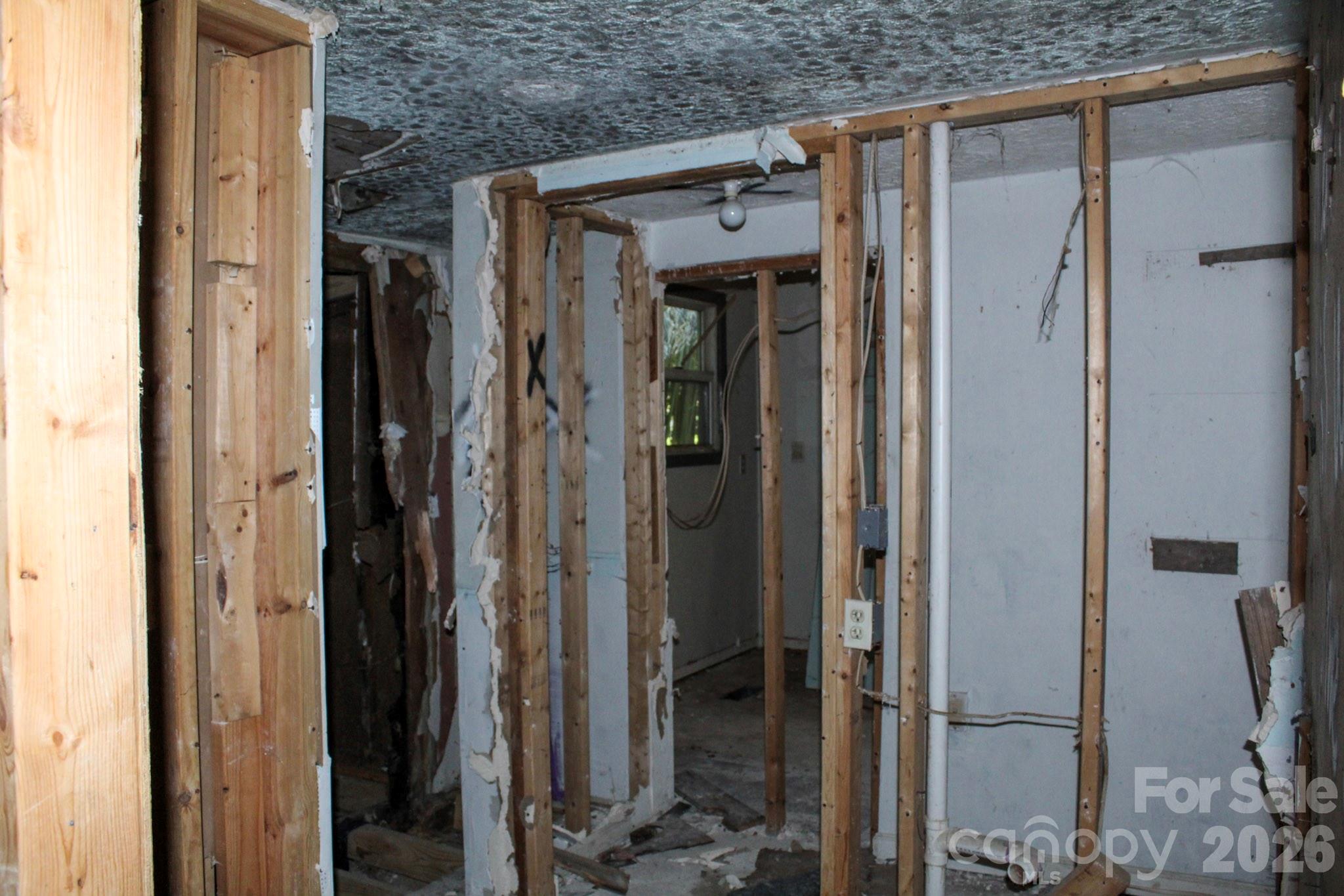 1293 Lake Logan Road Canton, NC 28716 - Photo 29 of 48 a view of a walk in closet and bathroom