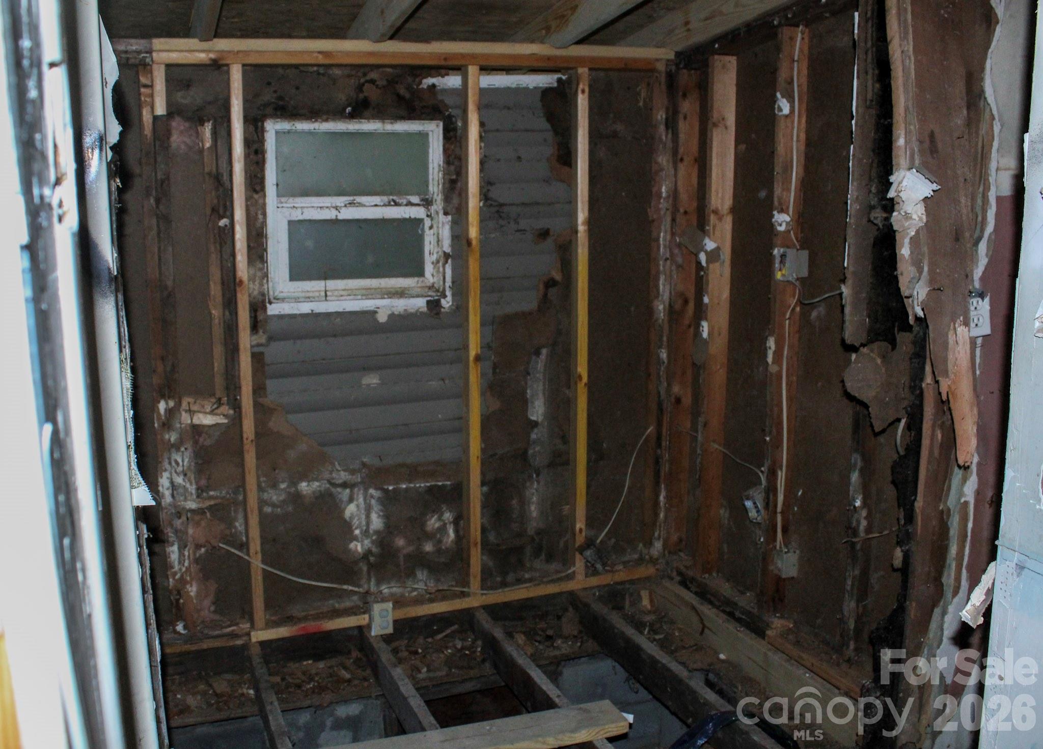 1293 Lake Logan Road Canton, NC 28716 - Photo 30 of 48 a bathroom with a glass shower door