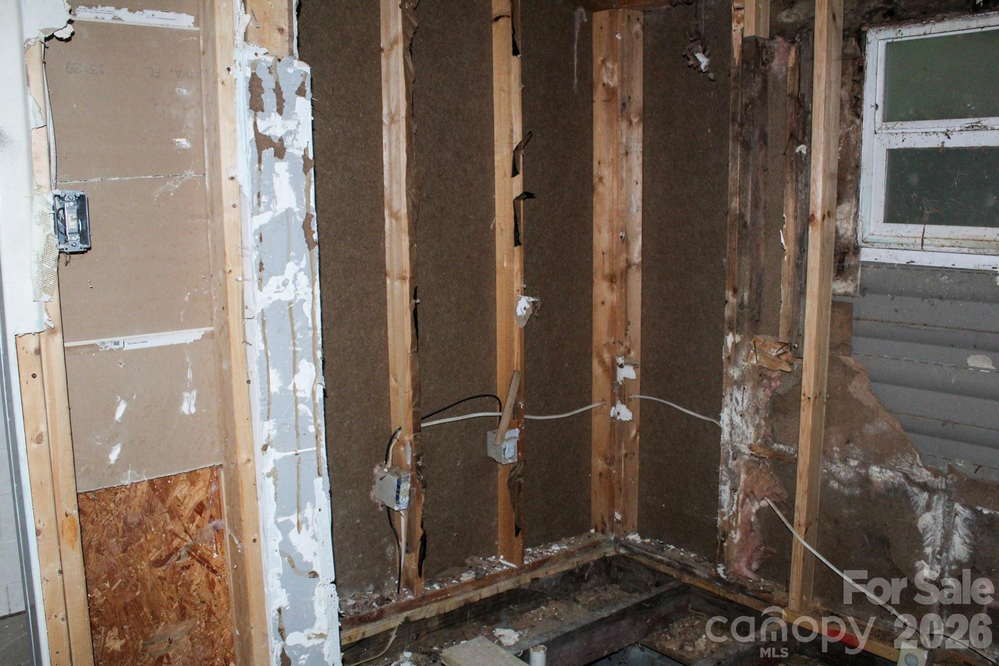 1293 Lake Logan Road Canton, NC 28716 - Photo 31 of 48 a room with water heater and a shower