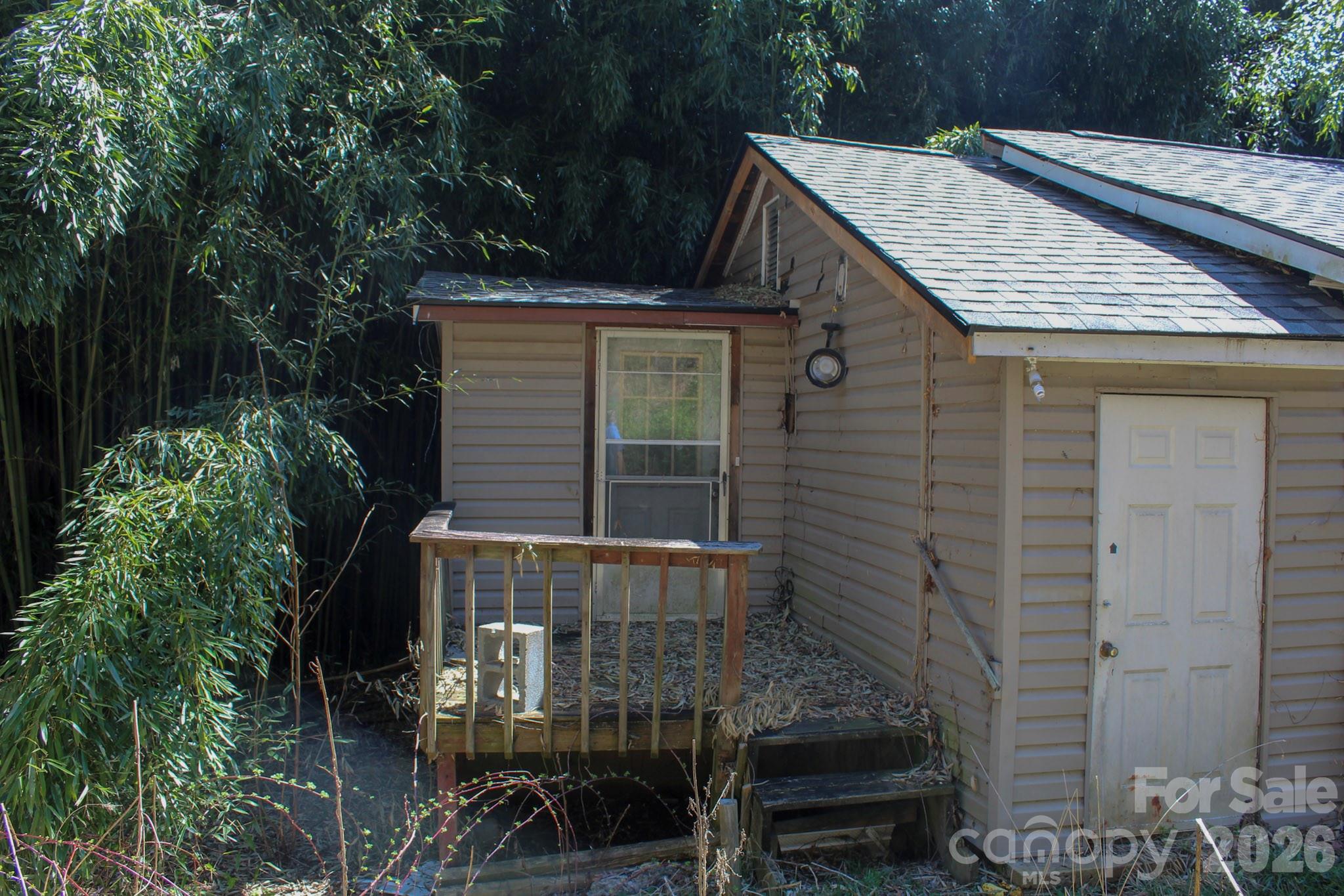 1293 Lake Logan Road Canton, NC 28716 - Photo 5 of 48 a view of a house with brick walls