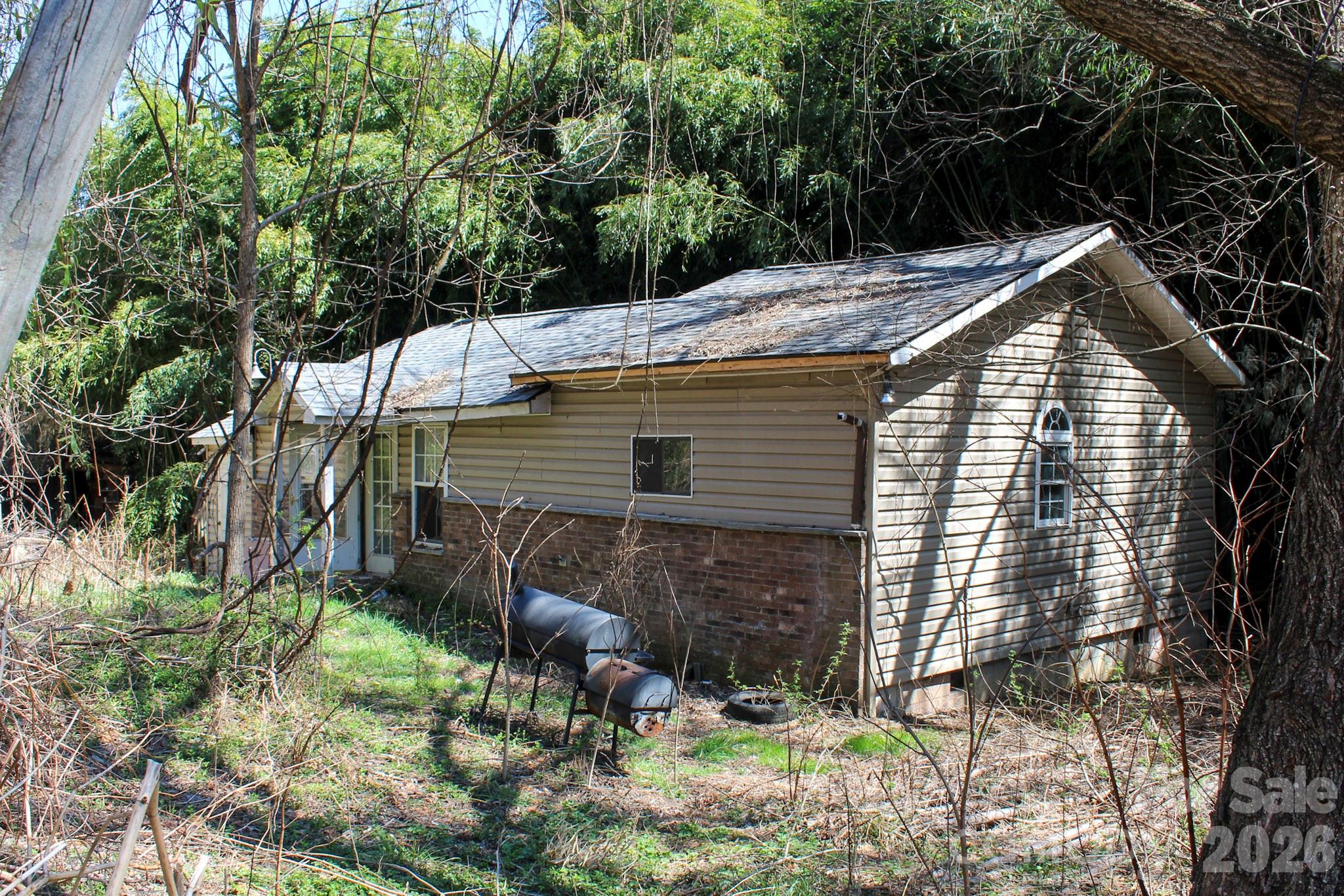 1293 Lake Logan Road Canton, NC 28716 - Photo 9 of 48 a view of house with backyard and sitting area