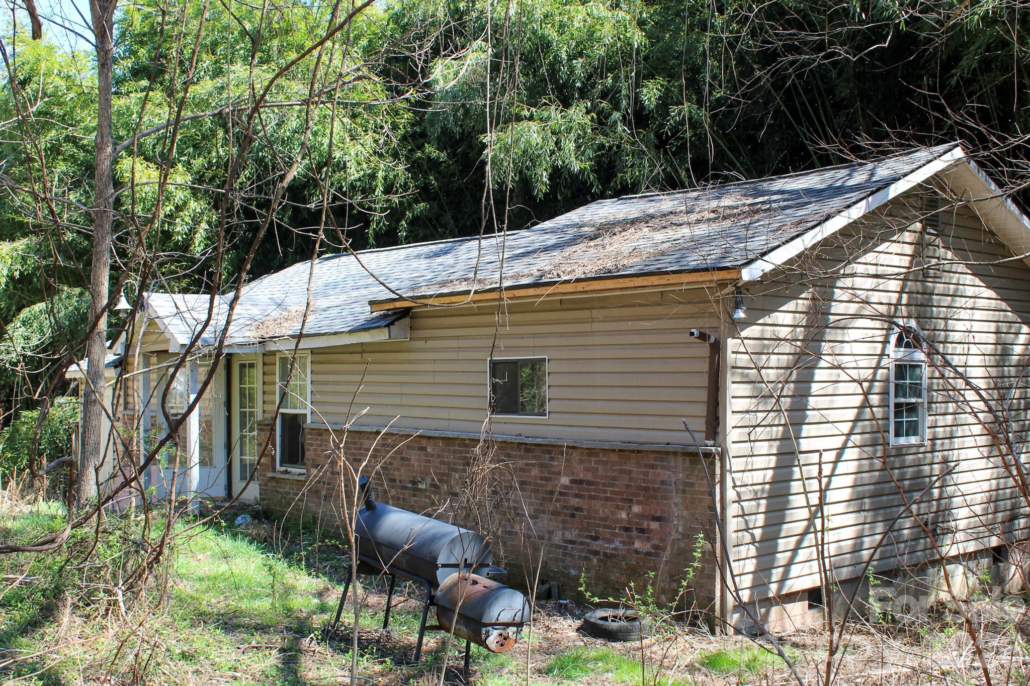 1293 Lake Logan Road Canton, NC 28716 - Photo 10 of 48 a backyard of a house with lots of green space