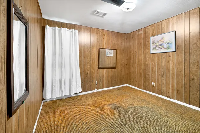 a view of a livingroom with a & ceiling fan